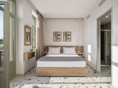 a bedroom with a large bed in a room at Cretan Berry Kondylaki in Chania Town
