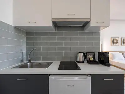 a kitchen with a sink and a counter top at Cretan Berry Kondylaki in Chania Town