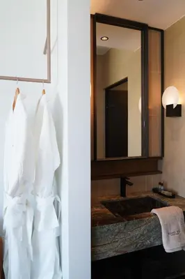 a bathroom with a sink and a mirror at AGAVE HILL LUXURY HOUSE in Chania Town