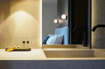 a bathroom counter with a sink and a mirror at AGAVE HILL LUXURY HOUSE in Chania Town