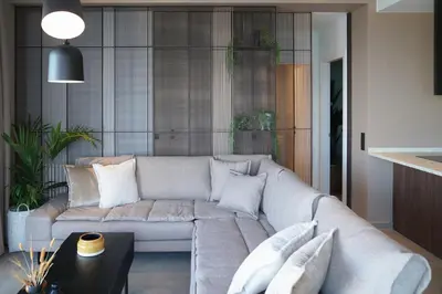 a living room with a couch and a table at AGAVE HILL LUXURY HOUSE in Chania Town