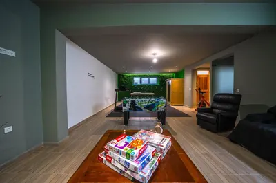 a living room with a table and a couch at Aiolos Executive Suite in Galatás