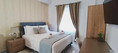 a bedroom with a bed with two stuffed animals on it at Virma Studio in Chania Town