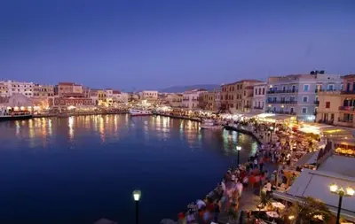 a group of people walking along a river at night at Virma Studio in Chania Town