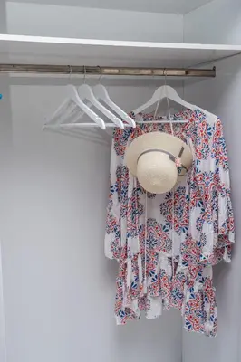 a closet with a curtain and a hat and a light at ''Meraviglia casa'' Christin in Kato Daratso