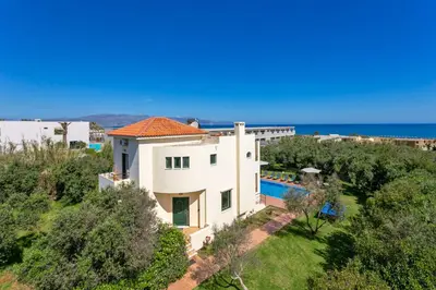 an aerial view of a house with a swimming pool at Villa Ilos by Villa Plus in Pírgos Psilonérou