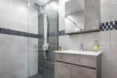 a bathroom with a sink and a shower at Villa Denise in Kalyves