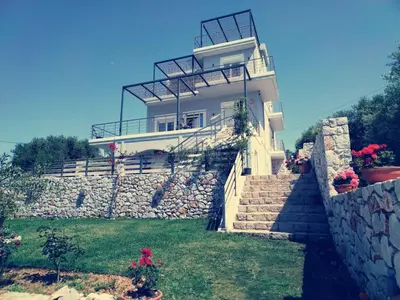 a house on top of a stone wall at Villa Denise in Kalyves