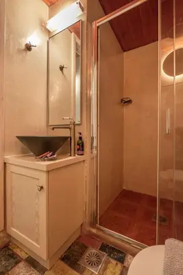 a bathroom with a shower and a sink at Avocado Villas in Chania Town