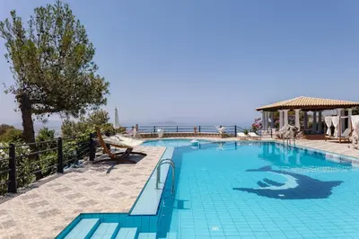 a swimming pool with a view of the ocean at Villa Paparouna in Chania Town