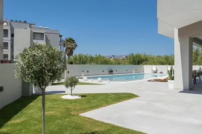 a view of the pool from the backyard of a apartment at Kallistefan in Kissamos