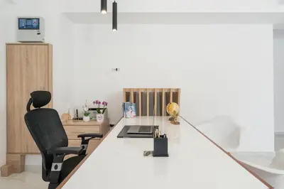 an office with a white desk and a black chair at Kallistefan in Kissamos