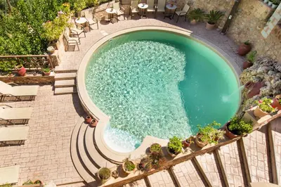 an overhead view of a swimming pool in a resort at Samonas - Blue villa Mantzourana in Khiliomoudhoú