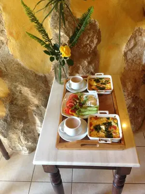 a table with two trays of food on it at Samonas - Blue villa Mantzourana in Khiliomoudhoú