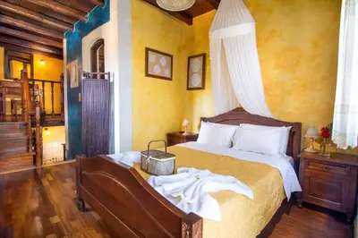a bedroom with a large bed in a room at Samonas - Blue villa Mantzourana in Khiliomoudhoú