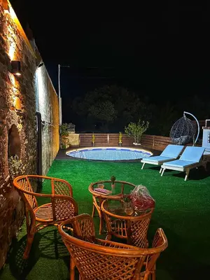 a patio with chairs and a table and a pool at DESTAN & JULIETTE SEA VIEW Villa in Kamisianá