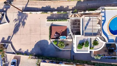 an overhead view of a house with a pool at Villy Luxury Home by the Sea 1 in Ayiá