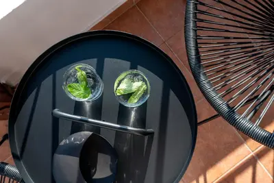 a table with two glasses of lettuce on it at ApteraMare Tradidtional house 'New listing' in Chania Town