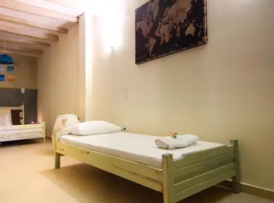 a bed with two pillows on it in a room at Auntie's home by Chania Old Harbor in Chania Town