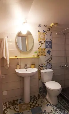 a bathroom with a sink and a toilet and a mirror at Auntie's home by Chania Old Harbor in Chania Town