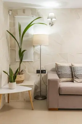 a living room with a couch and a table at Casa dei Sogni in Nerokoúros