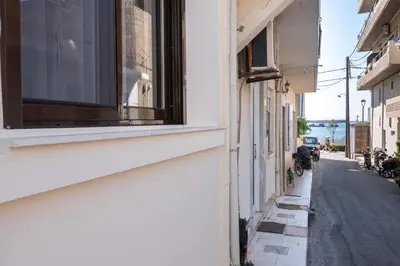 a building with a window on the side of a street at Casa Armonia Seaside by 8essentially in Chania Town