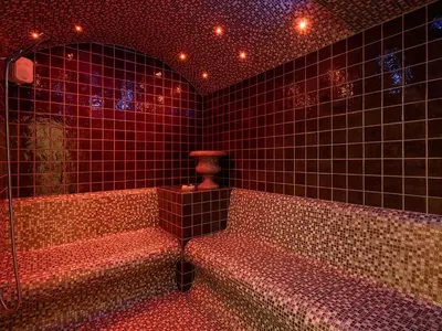 a bathroom with red tiled walls and a tub and a mirror at Villa Peacock with Spa Facilities in Daratso