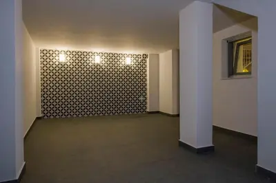 a hallway with a patterned wall with lights on it at Casa Di Camomilla in countryside in Chania Town