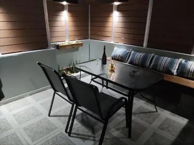 a dining room with a glass table and two chairs at Summer mood in Chania Town