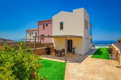 a villa with a view of the ocean at Villa Nektar with private ecologic pool and amazing view! in Kondópoula