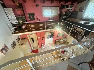 an overhead view of a living room with pink walls at Eco Friendly Country Home in Kókkinos Pírgos