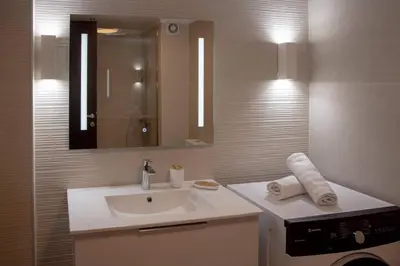 a bathroom with a sink and a mirror at Sfakion 6 apartment in Chania Town