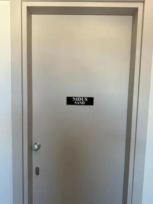 a door with a sign that says notesagents on it at Nidus President in Souda