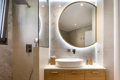 a bathroom with a sink and a mirror at Quiet Villa Aviana,garden, heated pool,BBQ,jacuzzi in Gerani Chanion