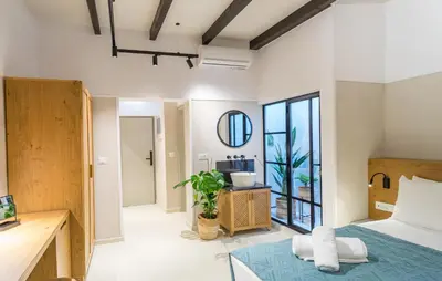 a bedroom with a bed and a mirror at Incentra in Chania Town