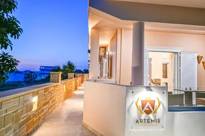 a building with a sign that says athens on it at Artemis No1 Apartment in Kissamos