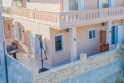 an aerial view of a house with a balcony at Artemis No.2 Apartment in Kissamos