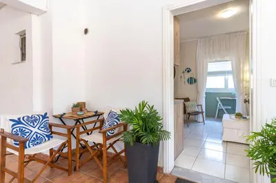 a dining room with a table and chairs in a room at Kaldora Apartment in Chania Town