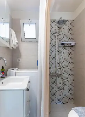 a bathroom with a shower and a sink at Kaldora Apartment in Chania Town