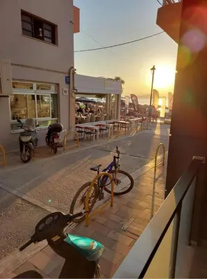 a bike parked on the side of a street at Rika’s Luxury seaside apartment in Chania Town