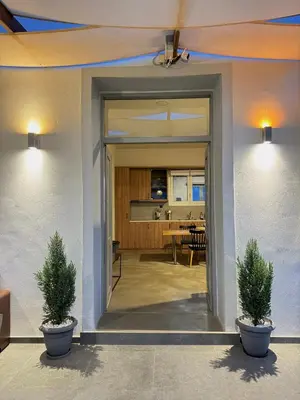 two potted plants in front of a door at Remvi Suite in Chania in Xamoudhokhórion