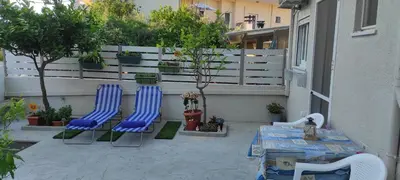 two blue chairs and a table on a patio at Shiny Luxe :) in Kissamos