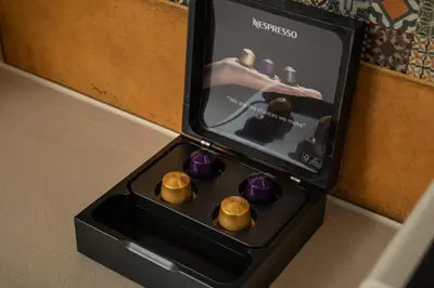 a black box with purple and gold chocolates at Dimitra Central Apts in Chania Town
