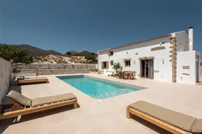 a villa with a swimming pool and a house at Villa Froudi in Kissamos