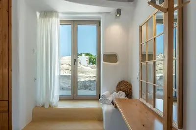 a room with a large glass door with a window at Villa Froudi in Kissamos