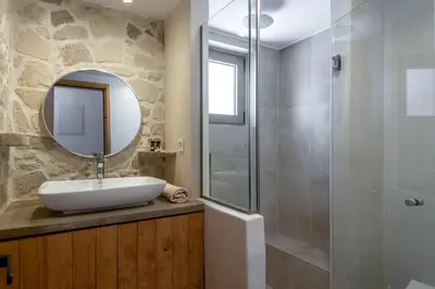 a bathroom with a sink and a shower at Villa Froudi in Kissamos