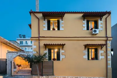 aige house with windows and a staircase in front at Dominic Chania 3 Room Apartment in Chania Town