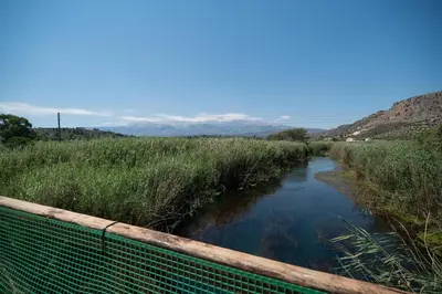 a river in the middle of a field at Kiani Apts in Kalyves