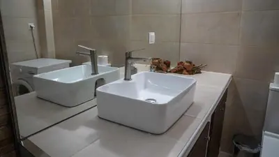 a bathroom with a sink and a toilet at KM Beach View apartment in Chania Town