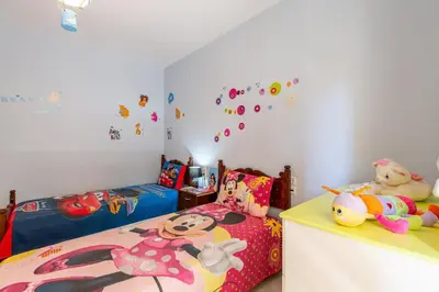 a childs bedroom with two beds and stuffed animals at Elena Apartment in Chania Town